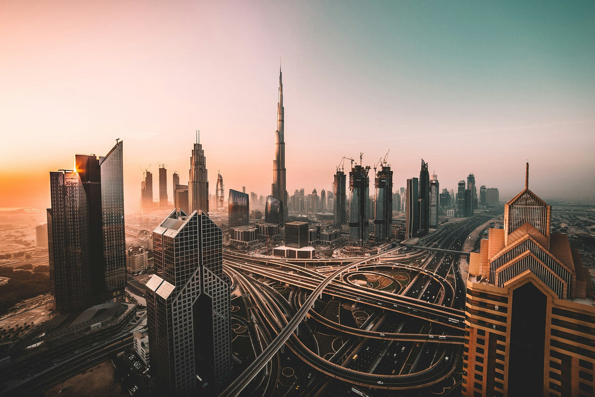 Burj Khalifa rising above the Dubai skyline at sunset